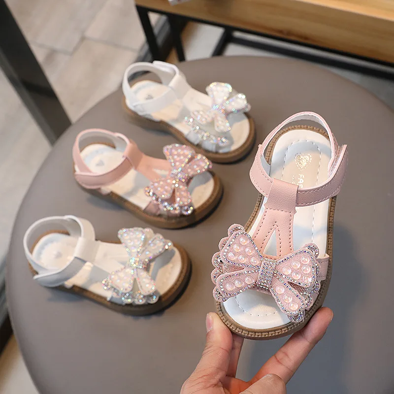 Модные повседневные сандалии для девочек 2023, летние новые Детские туфли принцессы на плоской подошве с бантом для корейских студентов, пляжная обувь для кампуса